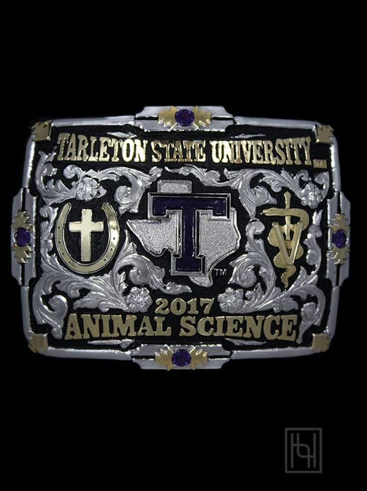 Silver Scrolls on Black Background, Yellow Gold Lettering, Yellow Gold Figures, Silver & Purple Tarleton State Die Strike, Silver Flowers & Leaves w/ Crystal Clear Accents, Yellow Gold & Purple Amethyst Accents in Edge