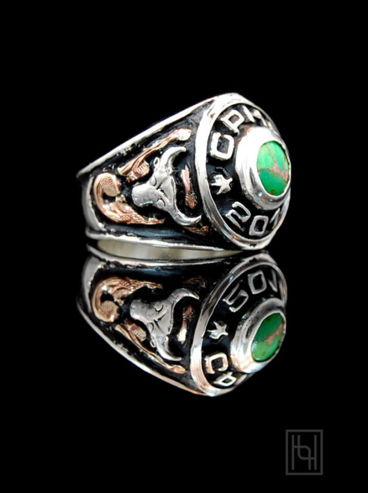 Custom men's ring with black background and rose gold scrolls, silver figures and 10mm round green turquoise stone, side view