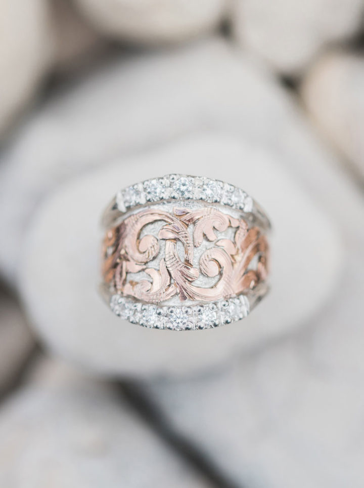 Silver ring with crystal clear cz accent stones and rose gold scrolls - River Rock Backdrop