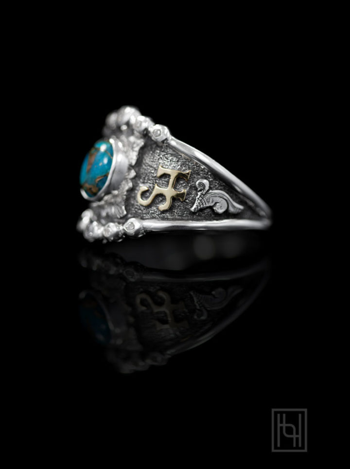 SVR-SCROLLS-&-OXIDIZED-YG-LETTERING,-9-x-7-MM-OVAL-TURQUOISE-COPPER-MATRIX,-CLEAR-ACCENT-STONES-SH