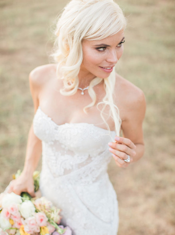 Pearl drop necklace and pearl ring worn by bridal model