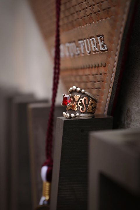 Custom Statement Ring for MSU - Shown with cap and tassle