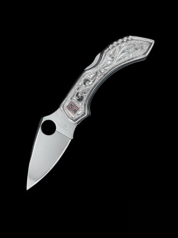 Drop point blade is made of high-carbon VG-10 steel for superior edge retention, custom knife w/ engraved scrolls