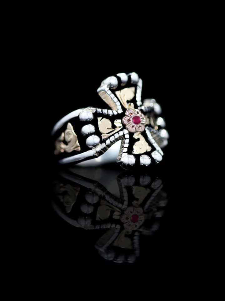 Yellow Gold Scrolls, Rose Gold Flower on Black Background w/ Ruby Red Accent Stone Cross Ring