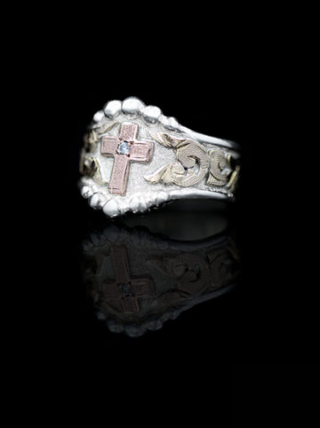 Silver ring w/ yellow gold scrolls, rose gold cross with small crystal clear cz stone in center
