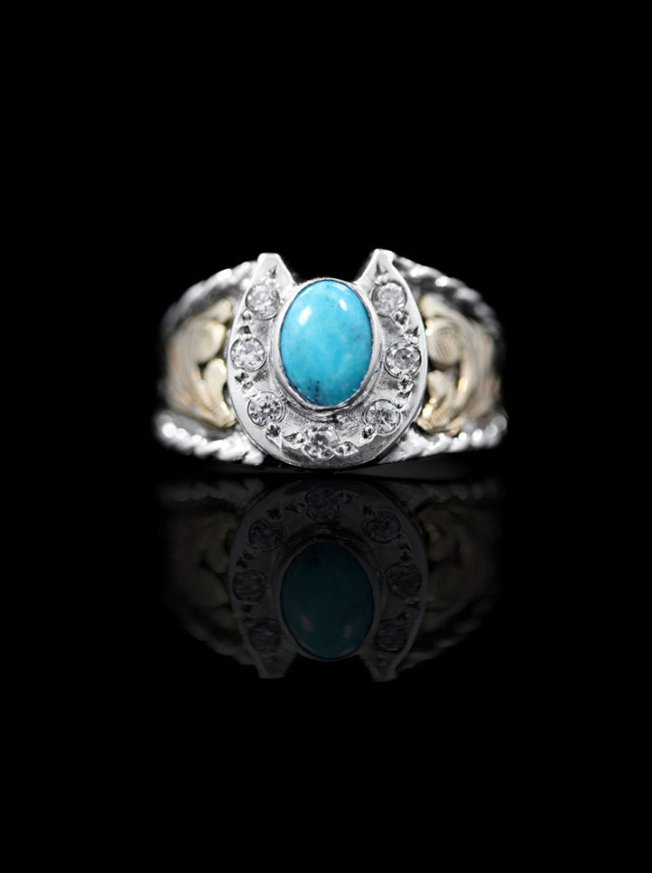 Sterling silver ring with cz shaped horseshoe and 6x8 oval Blue Turquoise in center