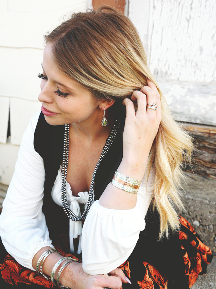 Lifestyle image of the Desert Rain Earrings and various other accessories