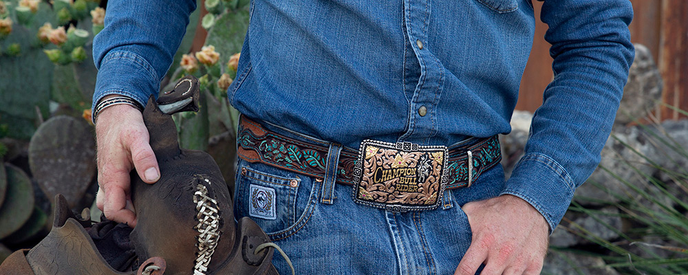 Western Rodeo Belt Buckle with Rose Gold Scrolls with Black Background and Yellow Gold Lettering