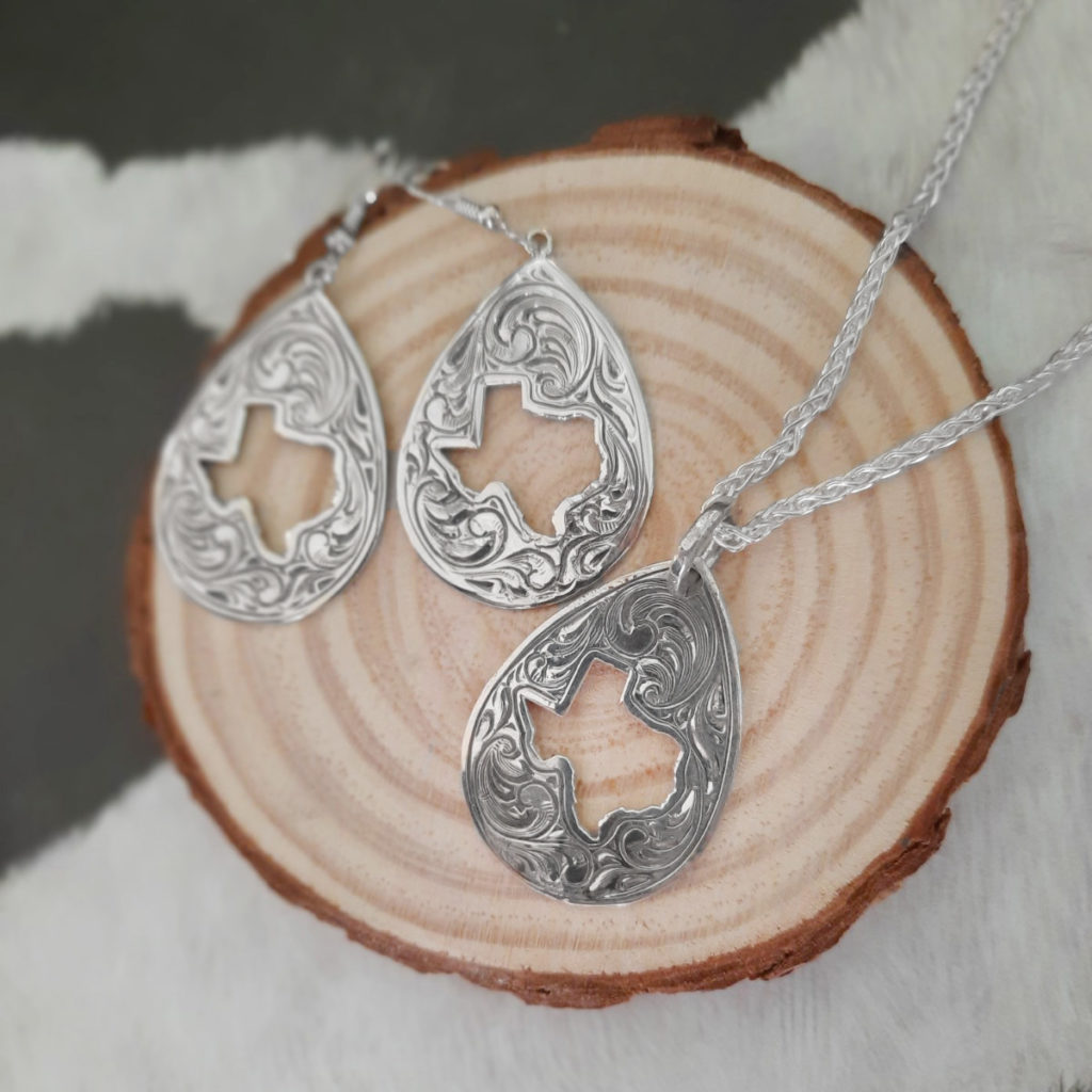 Teardrop shaped silver necklace and earring set with Texas Cutout