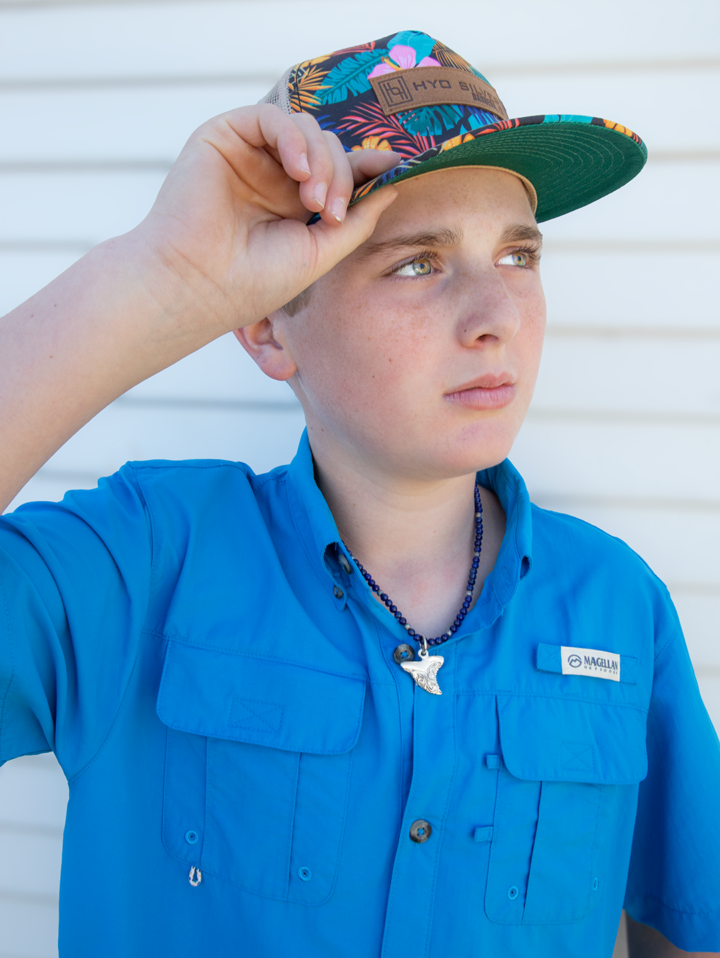 Product Image of a model wearing the Shark Tooth Pendant